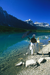 Tatianna O'Donnell painting beside Waterfowl Lake. Photograph by Frank O'Donnell